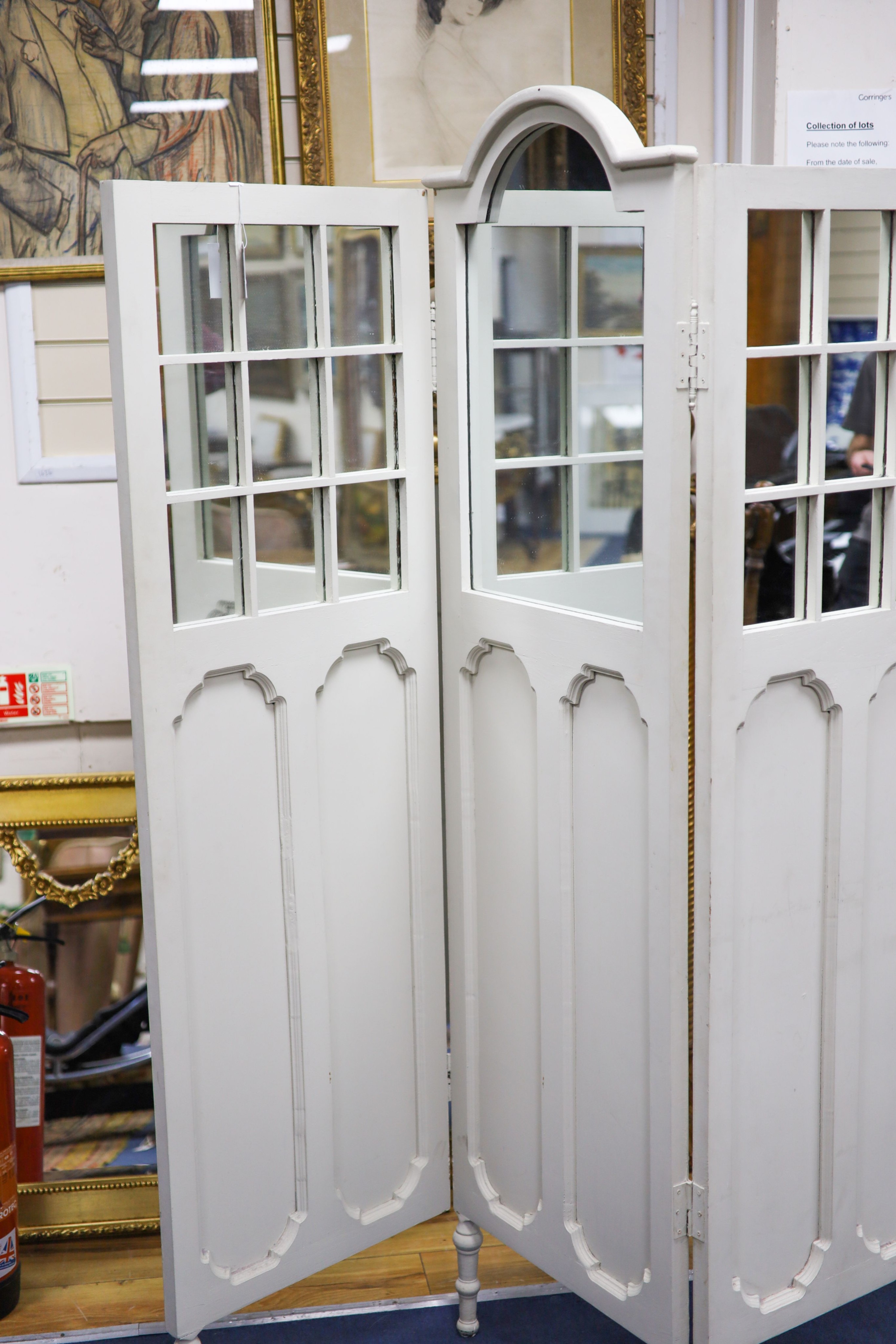 An early 20th century painted mirrored three fold dressing screen, maximum height 185cm